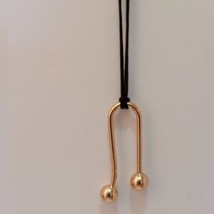 Geometric Shaped Gold Metal Pendant On Black Cord Necklace